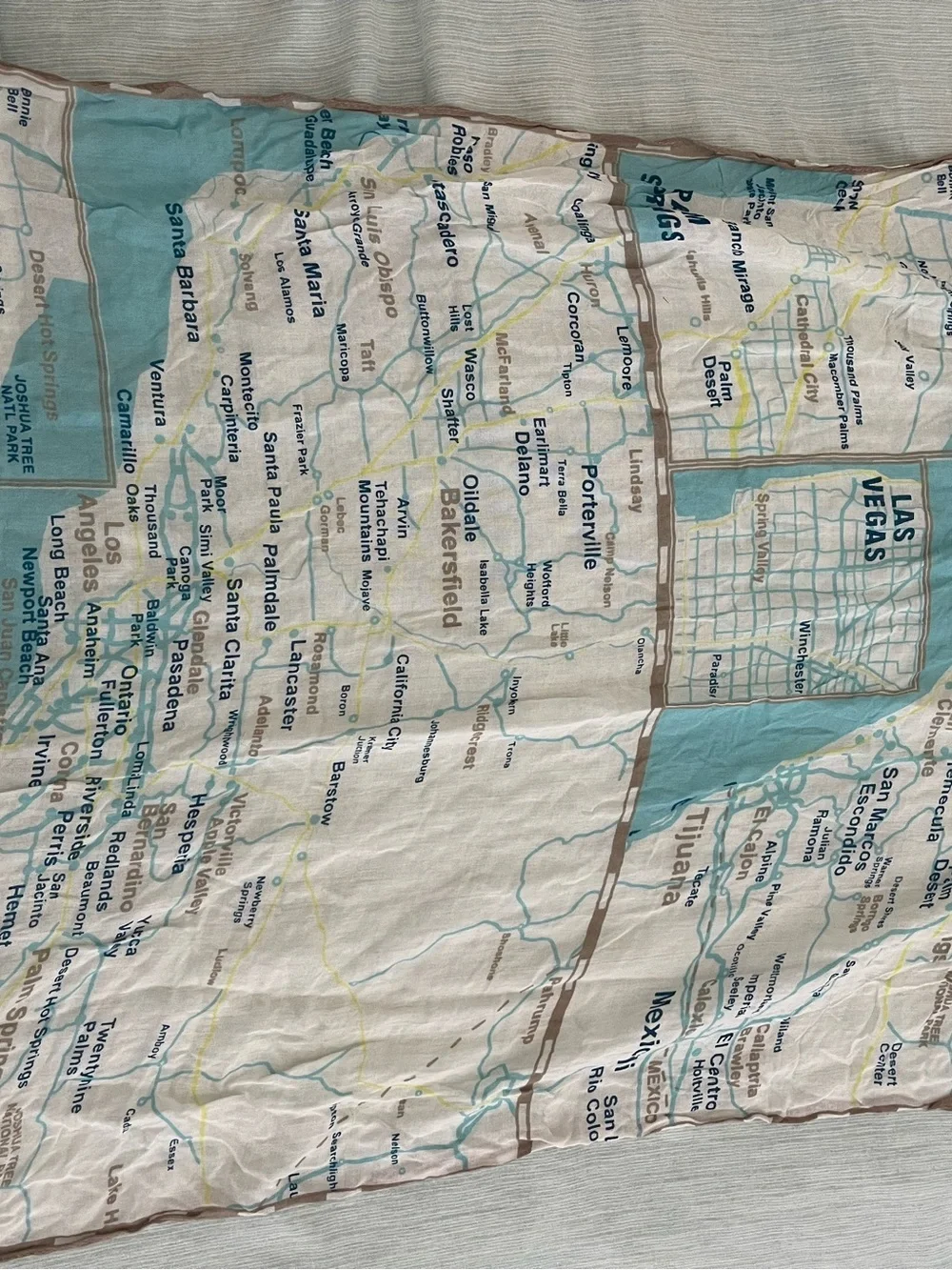kate spade off the map West Coaat print lightweight scarf in aqua and white